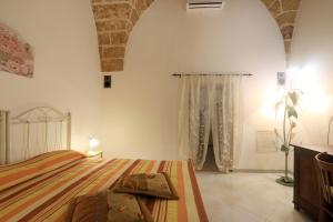 Postel nebo postele na pokoji v ubytování Corte Antica