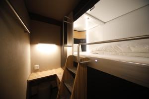 Ein Bett oder Betten in einem Zimmer der Unterkunft Dormy Inn Korakuen