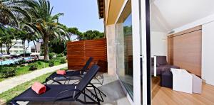 Сад в Hotel & Spa S'Entrador Playa