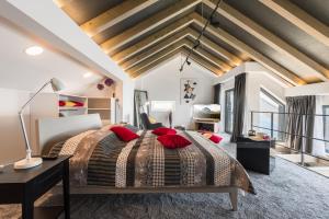 a bedroom with a large bed with red pillows at Residence Delta in Cavtat +74 photos