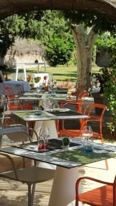 a group of tables with wine glasses on them at La Cauquière By L'Epicurienne in Le Beausset +22 photos