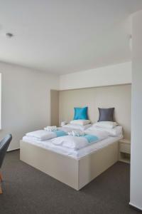 Postel nebo postele na pokoji v ubytování Hotel Rakovec