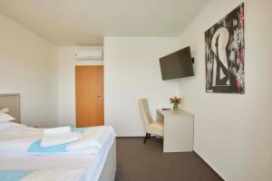 Postel nebo postele na pokoji v ubytování Hotel Rakovec
