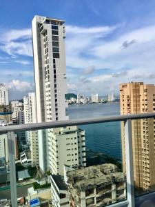 a view of a city from the balcony of a building at luxuriuso apartament in Cartagena de Indias