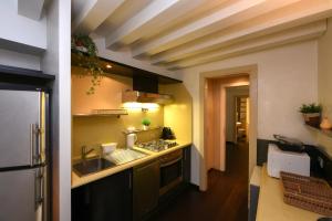 a kitchen with a sink and a counter top at Ca' Fenice 1921 in Venice