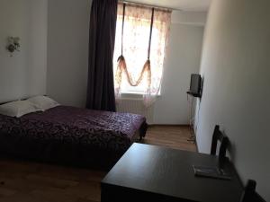 Postel nebo postele na pokoji v ubytování Pylypets Inn