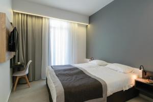 Postel nebo postele na pokoji v ubytování Renieris Hotel