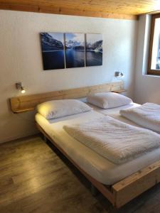 Postel nebo postele na pokoji v ubytování Hotel Restaurant Simplon