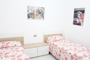 Een bed of bedden in een kamer bij La Fata
