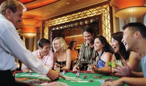 a group of people playing poker in a casino at Resorts Casino Hotel Atlantic City in Atlantic City