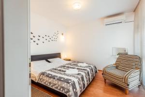 Posteľ alebo postele v izbe v ubytovaní Apartmani Gelo