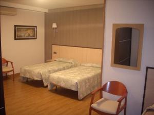 Postel nebo postele na pokoji v ubytování Hotel Corona de Castilla