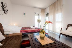 Un pat sau paturi într-o cameră la Apartmani Gelo