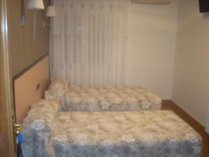 
Cama o camas de una habitación en Hotel Corona de Castilla

