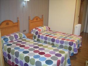 Postel nebo postele na pokoji v ubytování Hotel Corona de Castilla