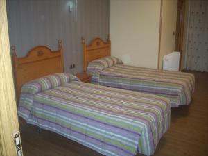 Postel nebo postele na pokoji v ubytování Hotel Corona de Castilla