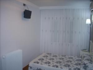 Postel nebo postele na pokoji v ubytování Hotel Corona de Castilla