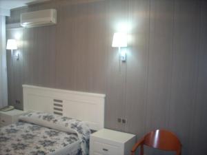 Postel nebo postele na pokoji v ubytování Hotel Corona de Castilla