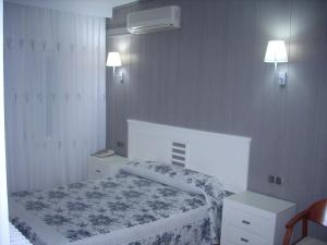 Postel nebo postele na pokoji v ubytování Hotel Corona de Castilla
