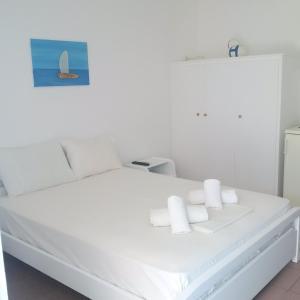 Cama ou camas em um quarto em Chaniotis Studios