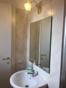 a bathroom with a sink and a mirror at B&B Sole Luna in Perugia +73 photos