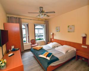 Postel nebo postele na pokoji v ubytování Hotel 'T Hert