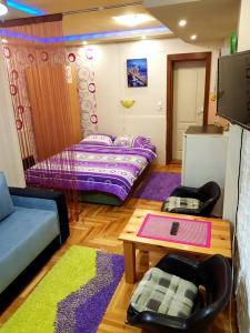 Кровать или кровати в номере Apartmani Dona
