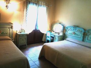 Postel nebo postele na pokoji v ubytování Cortebella B&B Rimini