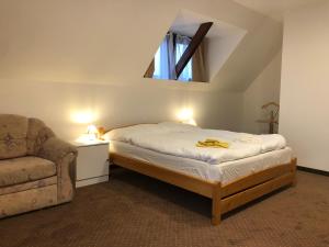 Кровать или кровати в номере SeSil Apartman