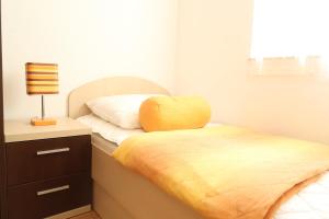 Postel nebo postele na pokoji v ubytování Apartments Maras
