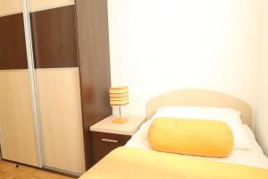 Postel nebo postele na pokoji v ubytování Apartments Maras