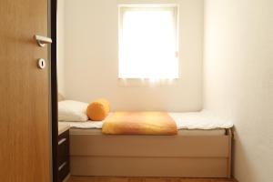 Postel nebo postele na pokoji v ubytování Apartments Maras