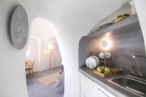 A kitchen or kitchenette at Santorini Villas