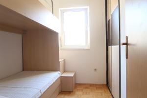 Postel nebo postele na pokoji v ubytování Apartments Maras