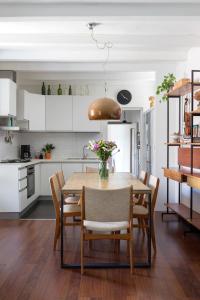 a kitchen and dining room with a table and chairs at Casa Rina in Cannobio