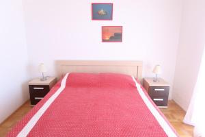 Postel nebo postele na pokoji v ubytování Apartments Maras
