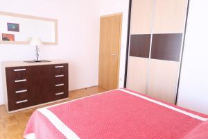 Postel nebo postele na pokoji v ubytování Apartments Maras