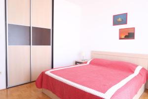 Postel nebo postele na pokoji v ubytování Apartments Maras