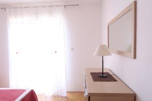 Postel nebo postele na pokoji v ubytování Apartments Maras