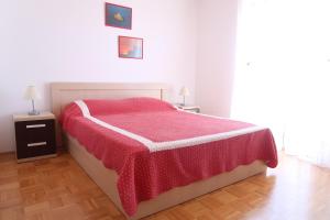 Postel nebo postele na pokoji v ubytování Apartments Maras