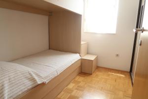 Postel nebo postele na pokoji v ubytování Apartments Maras