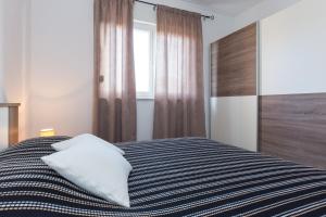 Posteľ alebo postele v izbe v ubytovaní App La Vita e bella - Marone
