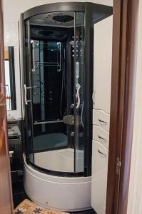 a bathroom with a large mirror on a cabinet at Apartment on Parkova 36 in Chornomorsk