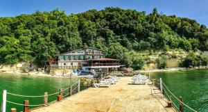 a building on a dock in the water at Hotel Romantika in Varna City