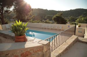 a villa with a swimming pool and a balcony at Villa Elpiniki in Troulos