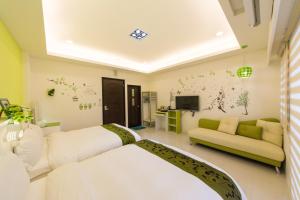 Una televisión o centro de entretenimiento en 醇境民宿 Pure B&B
