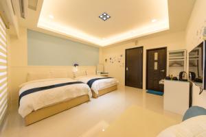 Cama o camas de una habitación en 醇境民宿 Pure B&B