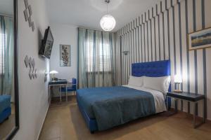 Postel nebo postele na pokoji v ubytování B&B Night&Day