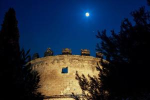 an old castle with the moon in the sky at Masseria Nucci - Autentica Dimora Storica in Nardò +56 photos