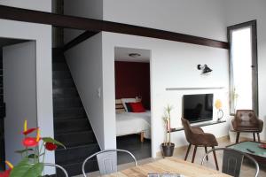 TV a/nebo společenská místnost v ubytování Ma Maison